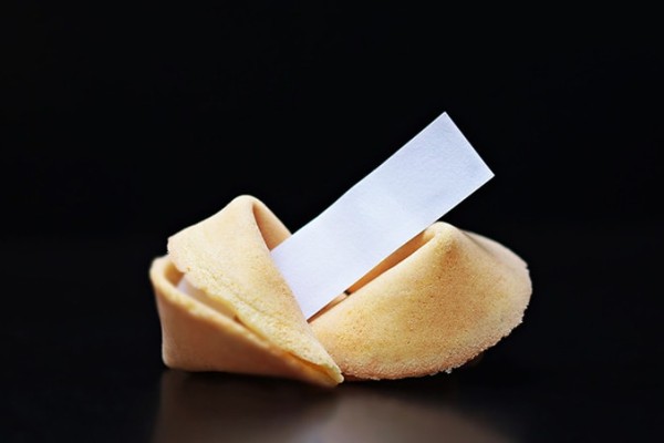 a-fortune-cookie-on-black-background